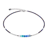 Necklace with blue and silver beads on a white background
