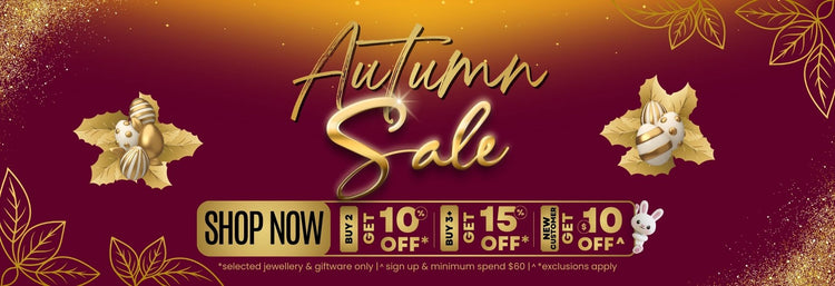 Autumn sale banner with easter eggs, leaves, glitter, cute bunny popping out from behind discount text on a maroon background.