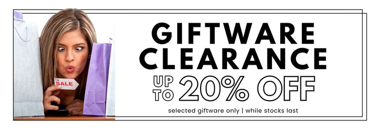 Sale banner for Giftware Clearance with a woman between gift bags and holding a small sale tag.