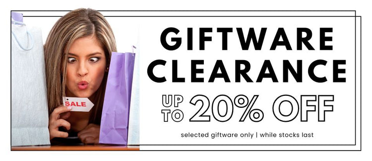 Giftware clearance sale banner with a woman between gift bags and holding a small sale tag.