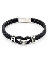 Black braided leather bracelet with silver metal accents on a white background