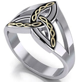 Silver triquetra trinity ring with gold knot design on a white background