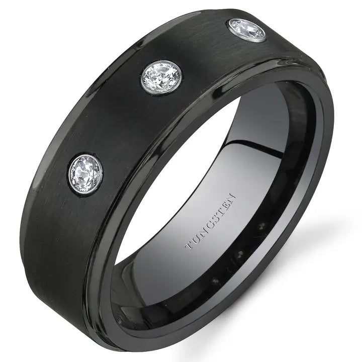 Black ring with three cubic zirconia on a white background