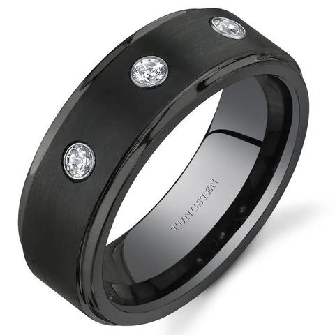 Black ring with three cubic zirconia on a white background