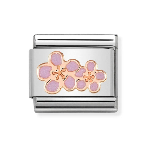 Silver charm with pink floral design on a white background