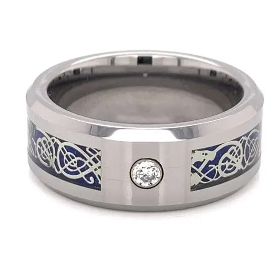 Silver ring with blue and white designs and a cubic zirconia on a white background