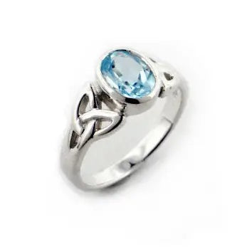 Silver trinity triquetra ring with a genuine blue topaz gemstone on a white background