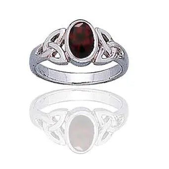 Silver trinity triquetra ring with a red gemstone on a white background