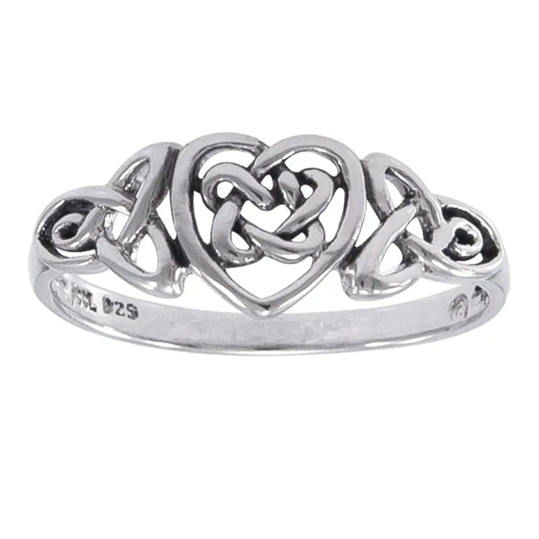 Silver ring with heart and Celtic triquetra trinity knot design on a white background