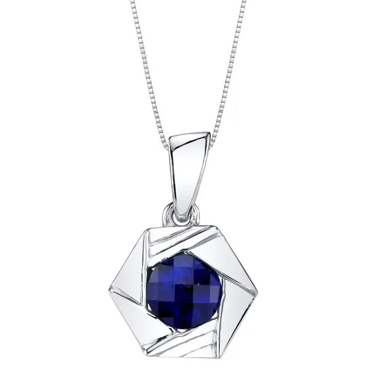 Silver pendant with a blue sapphire gemstone on a white background
