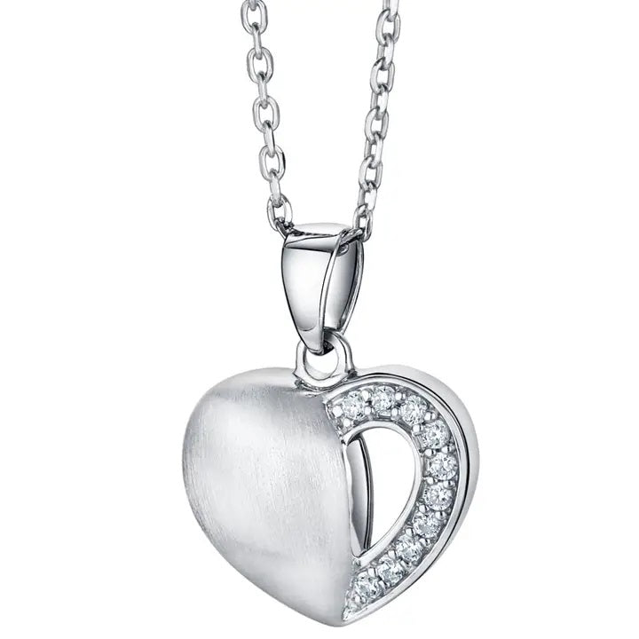 Silver heart-shaped pendant with clear cubic zirconia on a white background