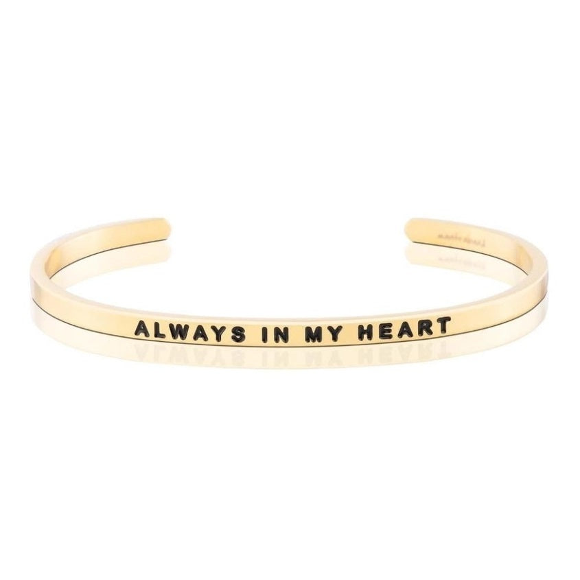 Gold bracelet with 'Always in My Heart' engraving on a white background