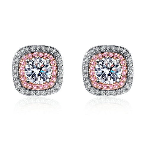 Pair of earrings with pink and clear moissanite gemstones on a white background