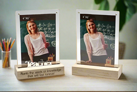 Two photo frames on stands with a person and inspirational text, placed on a surface.